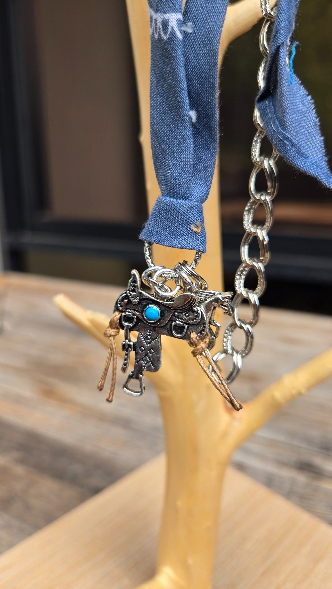 Blue fabric silver chain western charm detail