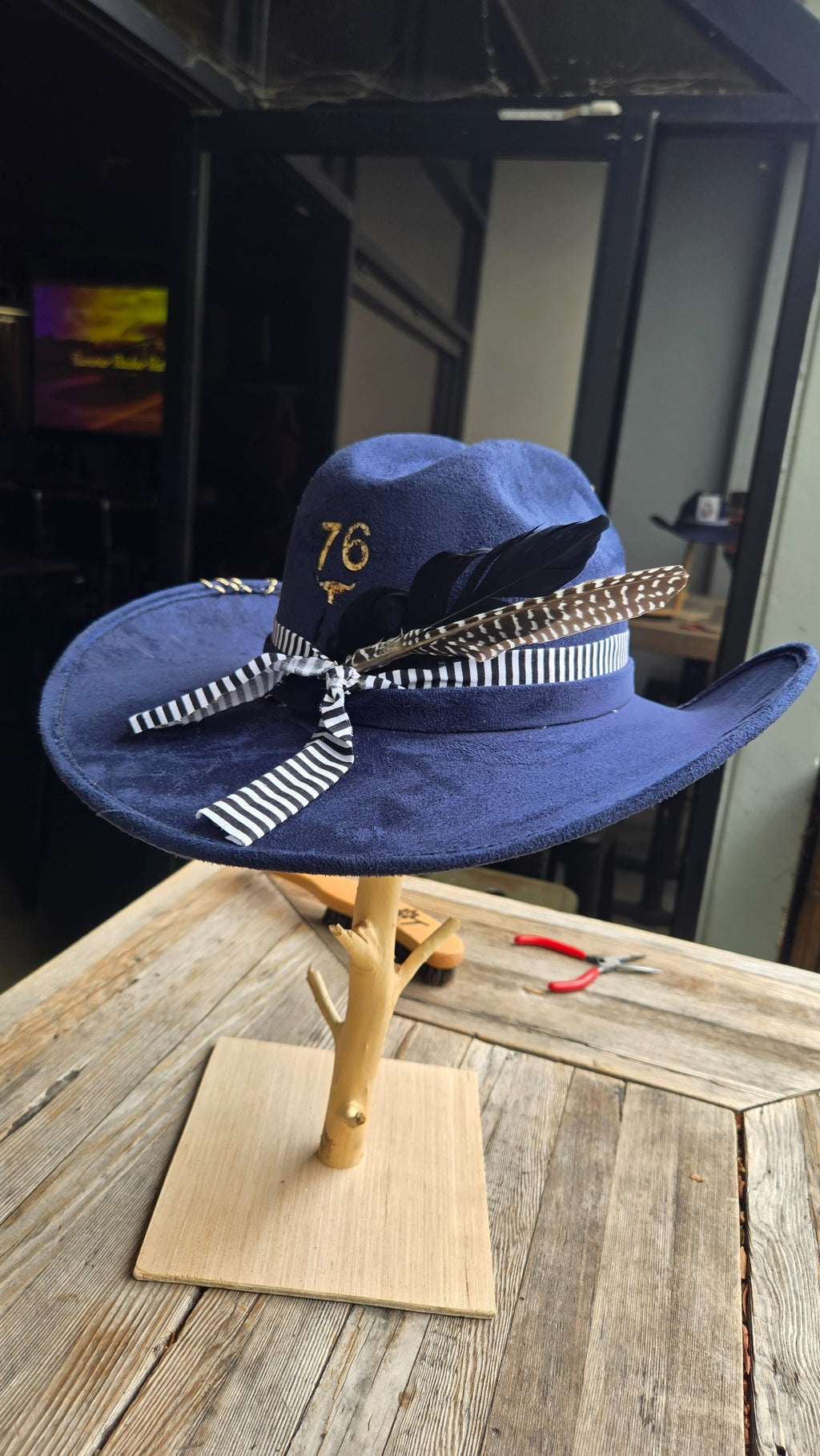 Navy western cowboy hat with number 76 and feather detail side view