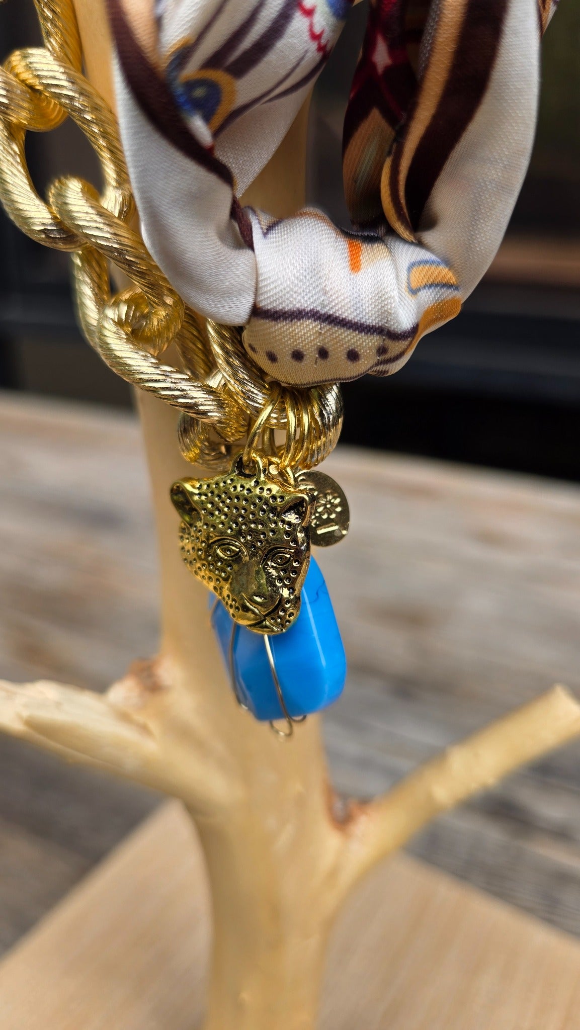 Paisley gold chain necklace with blue stone detail