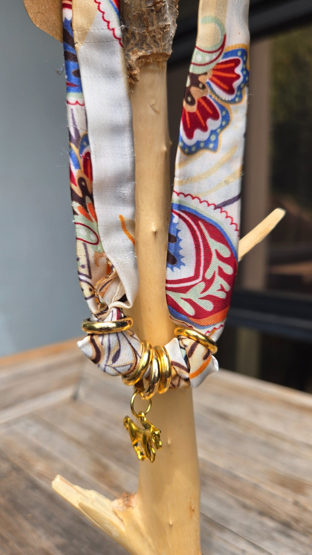 Paisley silk scarf charm necklace detail with gold rings