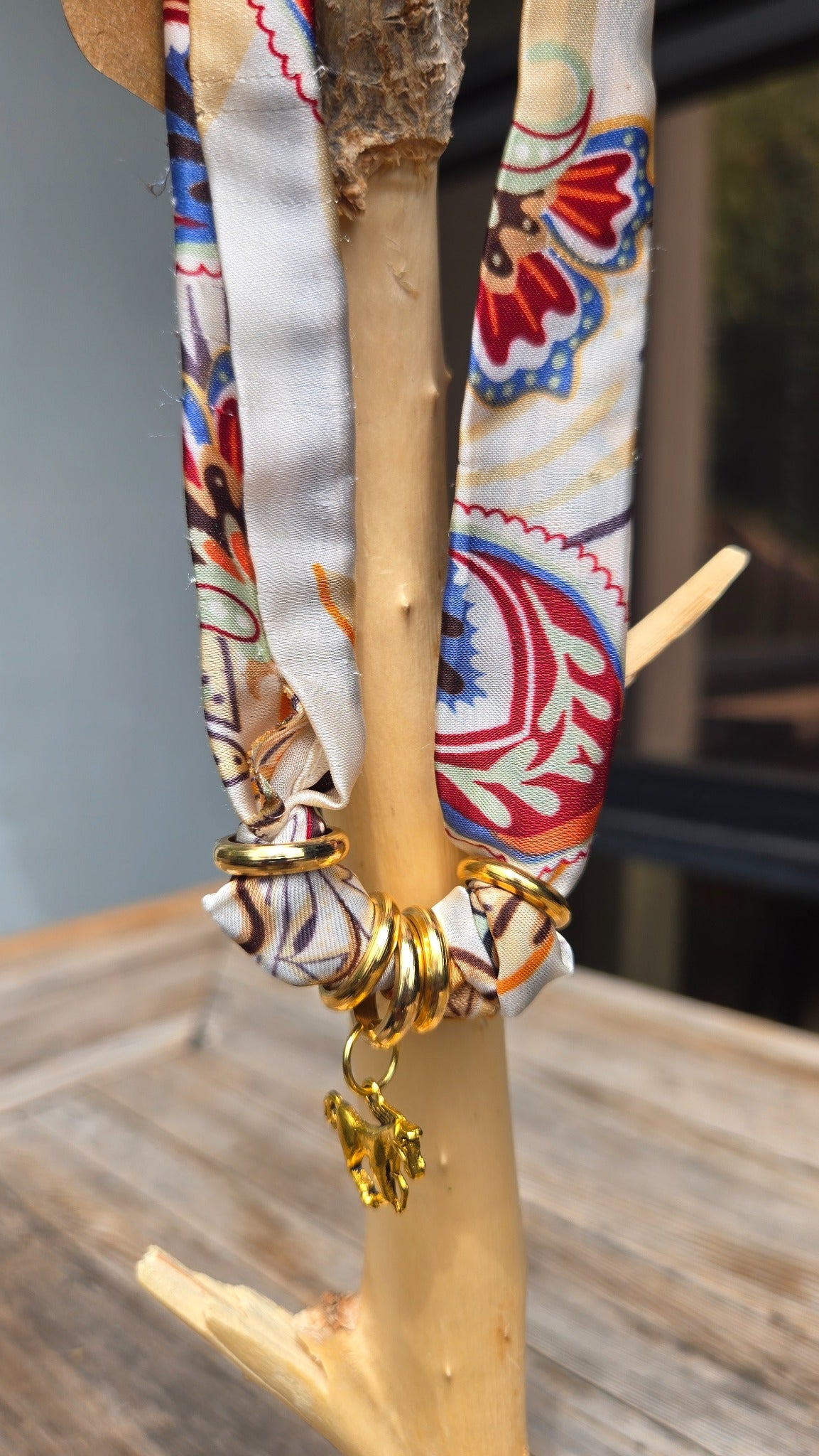 Paisley silk scarf charm necklace detail with gold rings