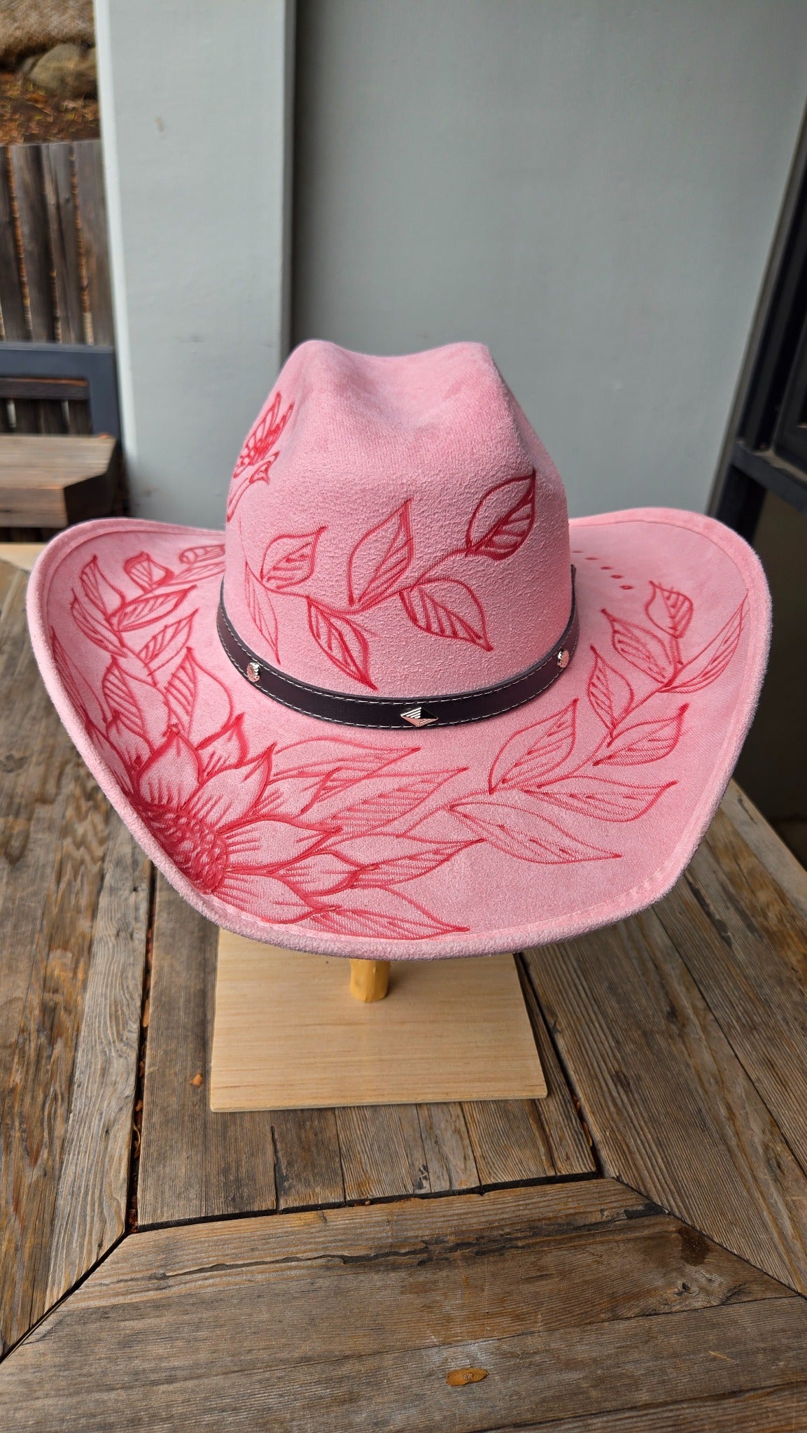 Pink western cowboy hat with floral engraved design