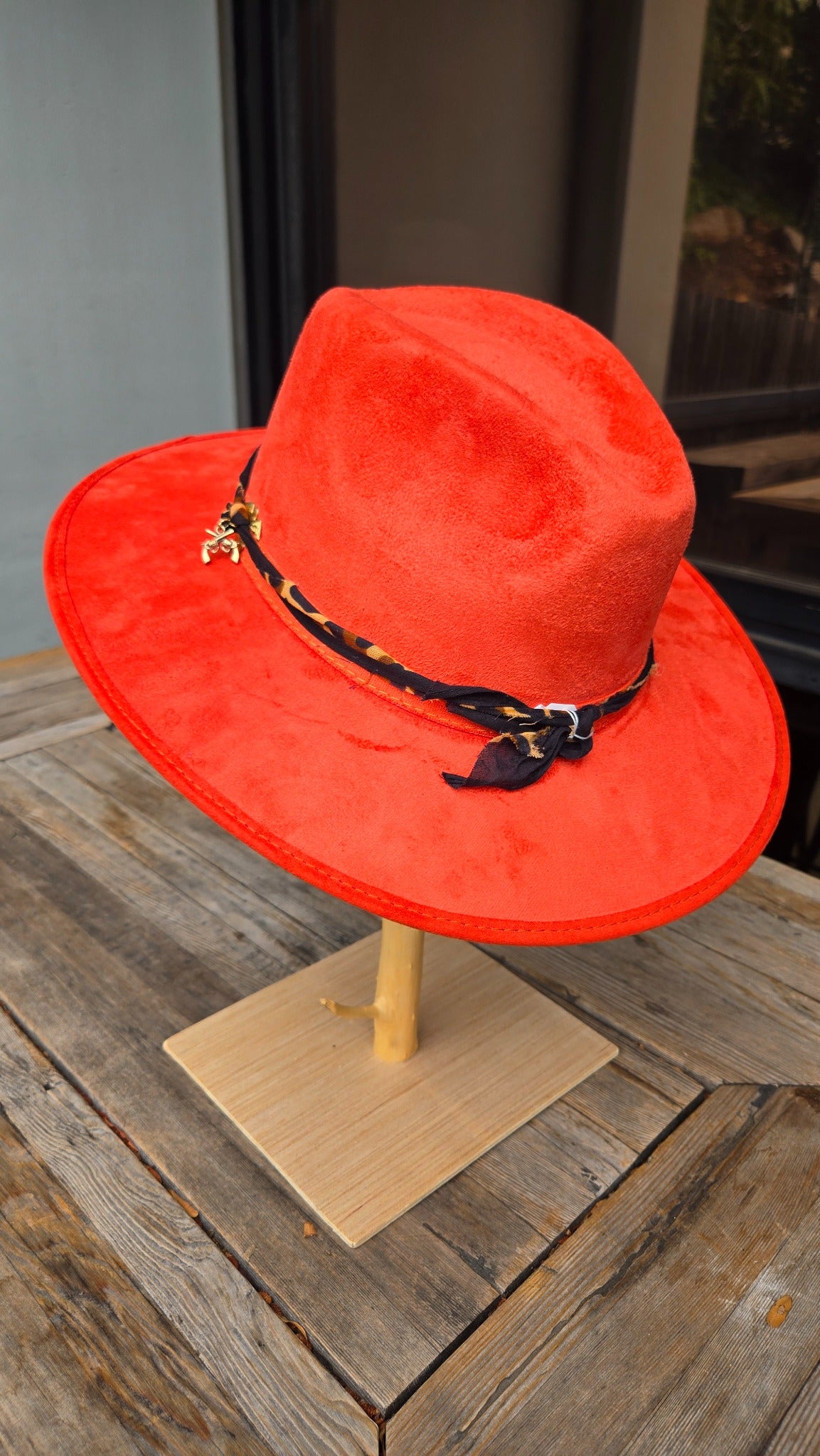 Red western cowboy hat back view with leopard scarf band