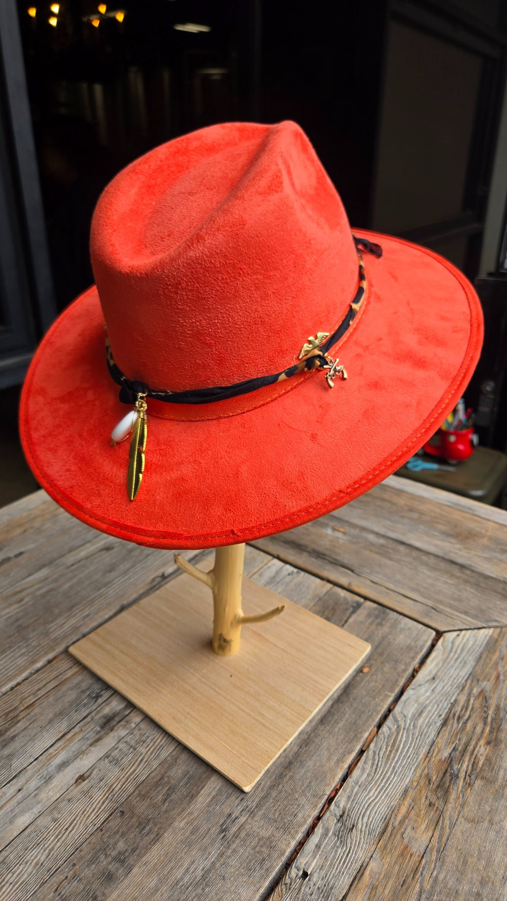 Red western cowboy hat with leopard scarf and gold charms front detail