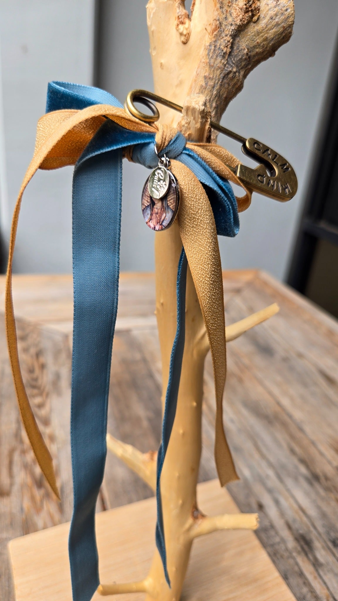 Teal and gold ribbon accessory charm side view